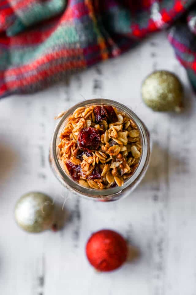 granola in a jar near Christmas ornaments
