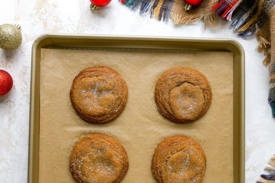 baked molasses cookies on a sheet pan