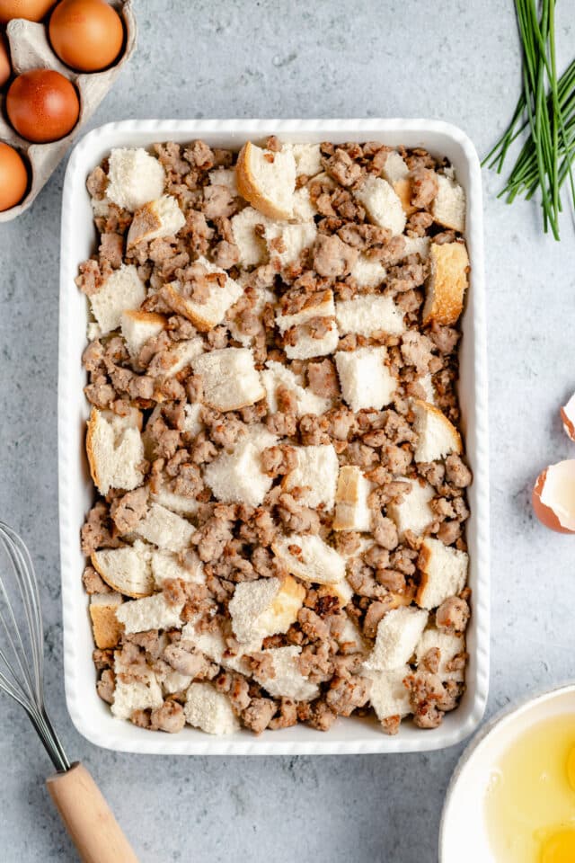 cubed bread topped with sausage crumbles