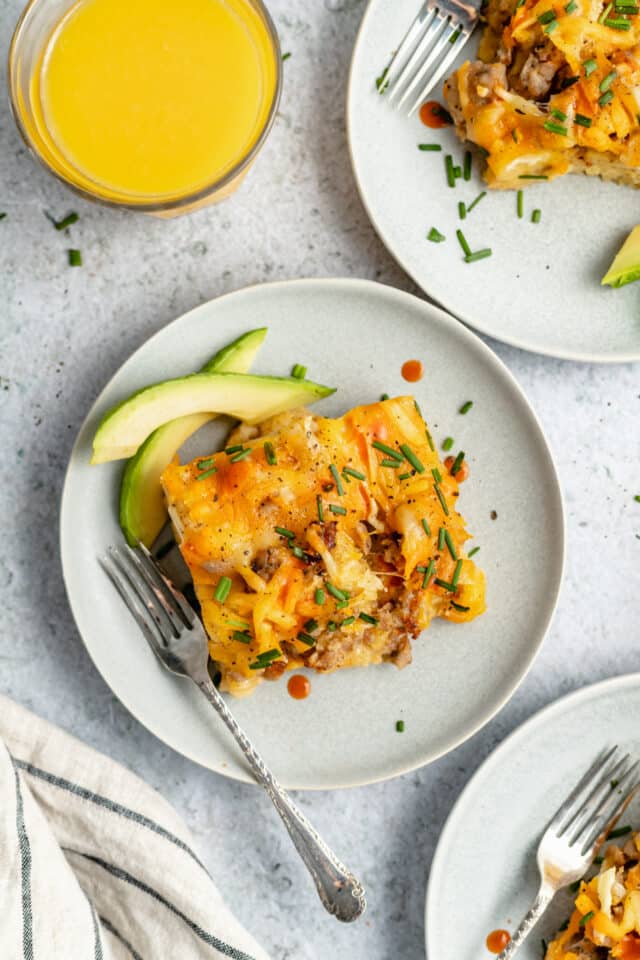 serving of sausage breakfast casserole with avocado slices