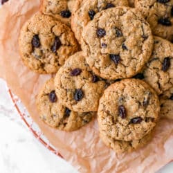 Best Oatmeal Raisin Cookies stacked on parchment paper