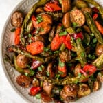 roasted vegetables in a large white serving bowl