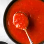 spoonful of homemade enchilada sauce