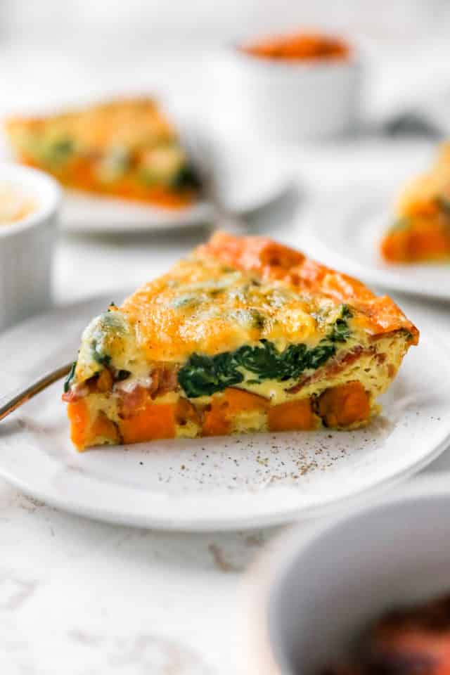 slice of sweet potato quiche with spinach