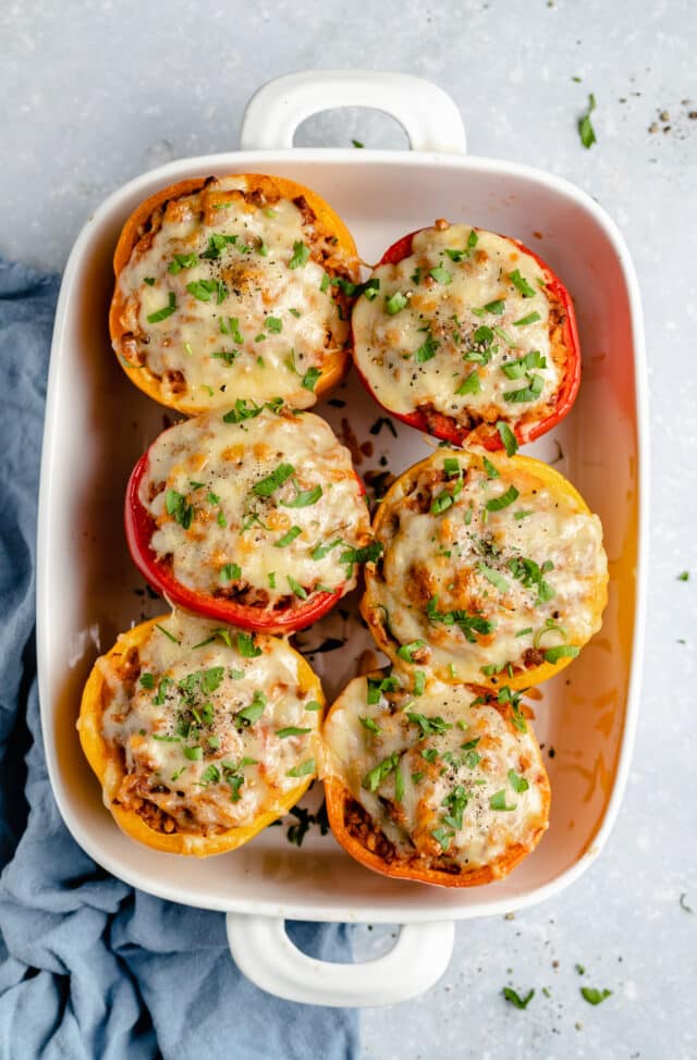 stuffed bell peppers in a baking dish