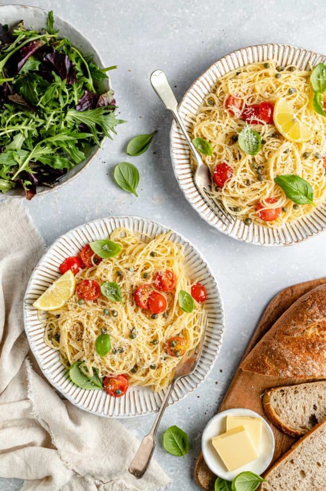 lemon pasta topped with cherry tomatoes and fresh basil