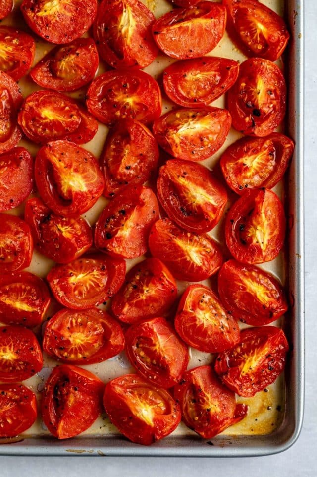 roasted tomatoes on a sheet pan