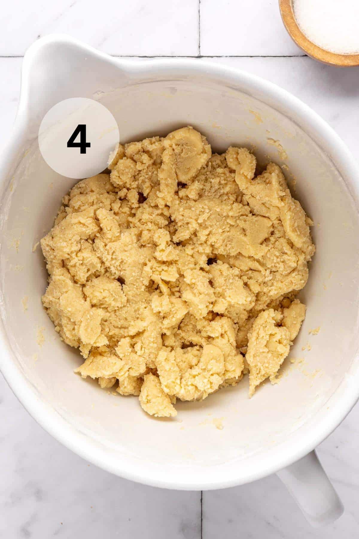 Sugar cookie dough in a large mixing bowl.