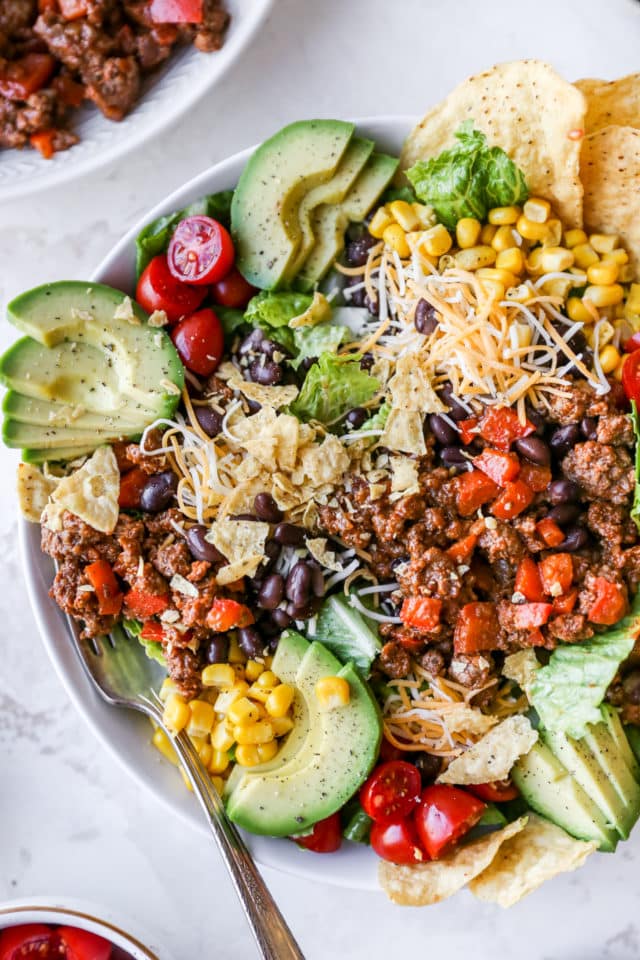 ground beef taco salad served in a large white bowl