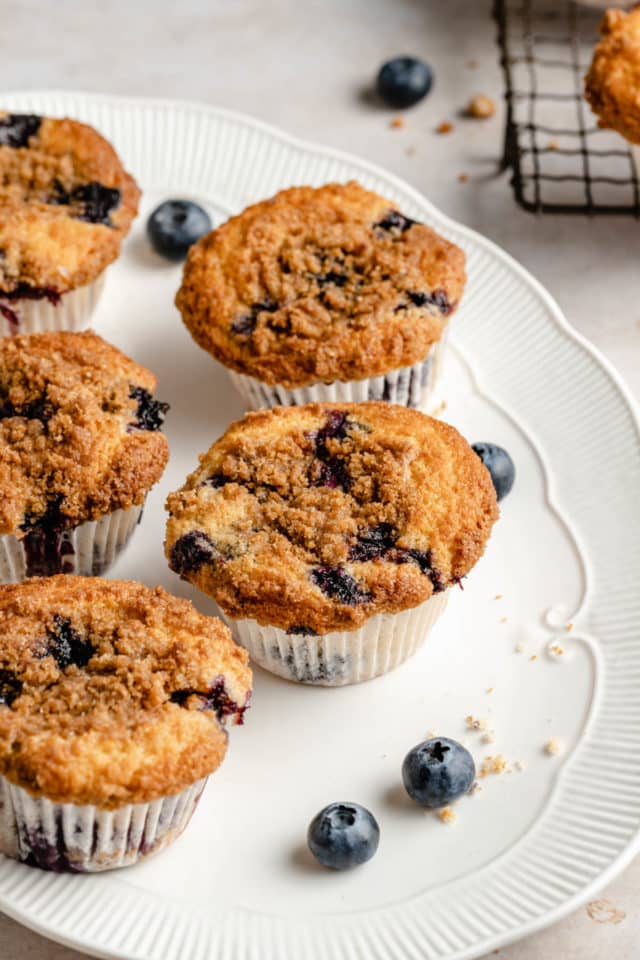 Blueberry Crumb Muffins on a large white serving plate