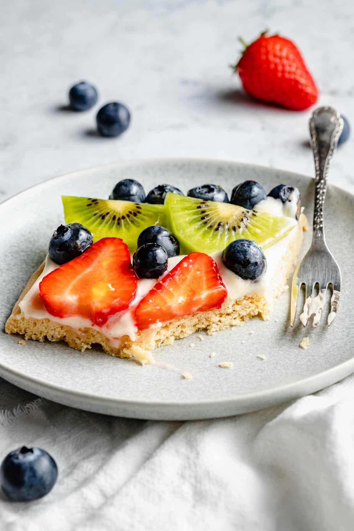 serving of fruit pizza dessert half eaten