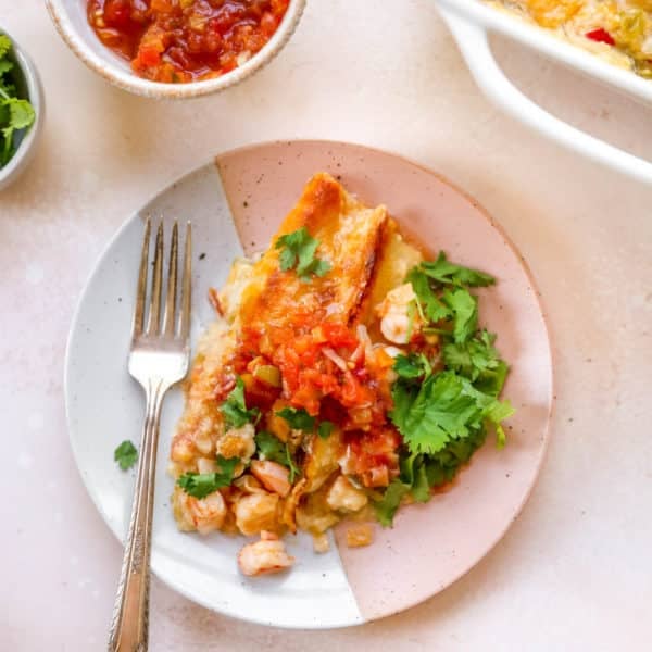 shrimp enchiladas served with salsa and fresh cilantro