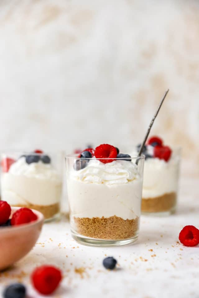 no bake cheesecake cups topped with fresh berries