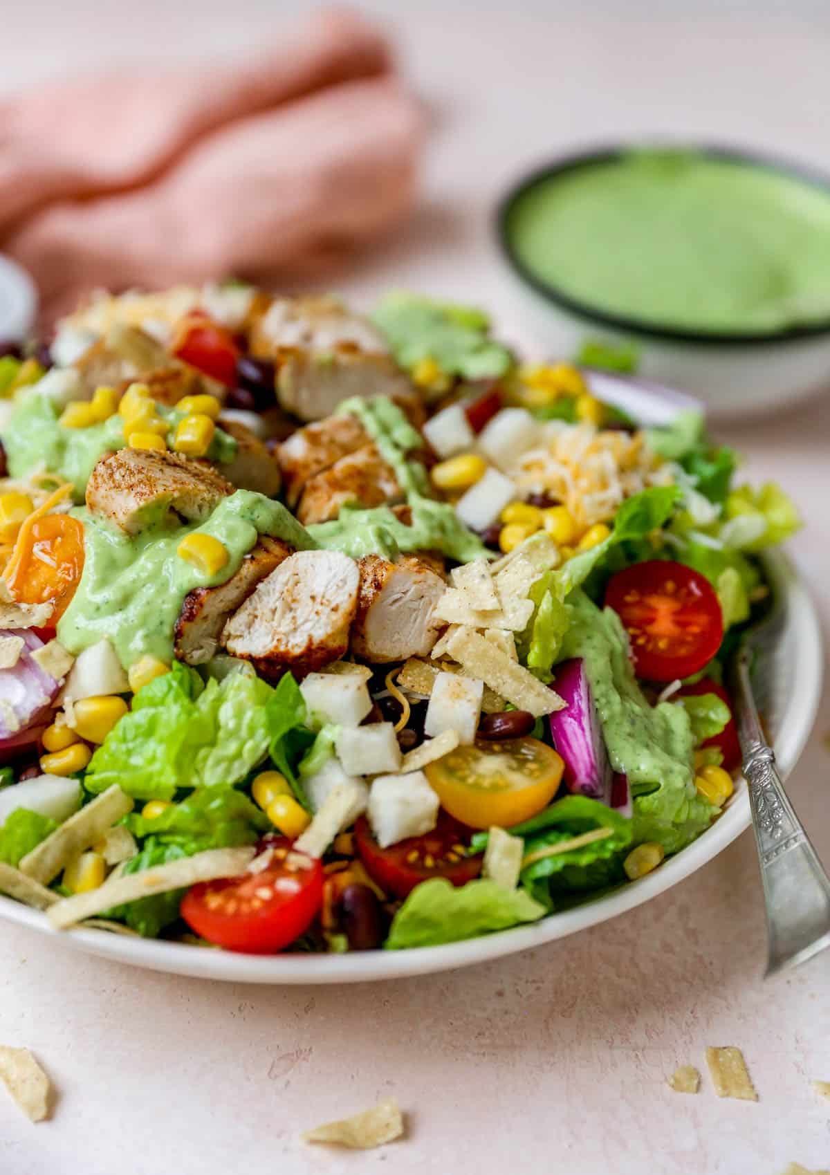 southwest salad topped with a creamy avocado dressing