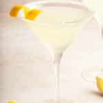 lemon drop martini garnished with a twist of lemon peel