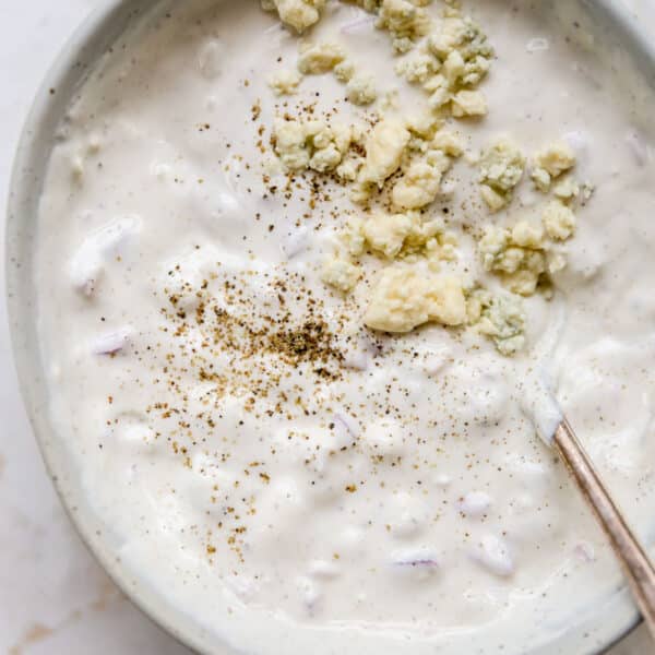 homemade blue cheese dressing topped with extra blue cheese crumbles