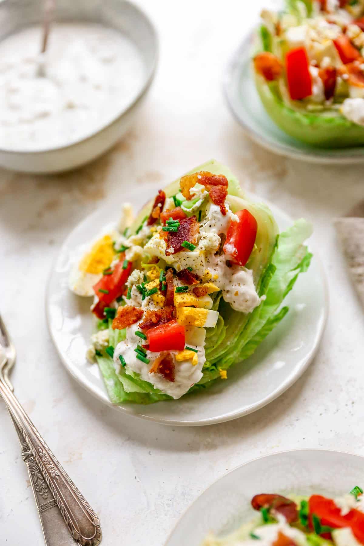 Wedge salad served on a small white salad plate.