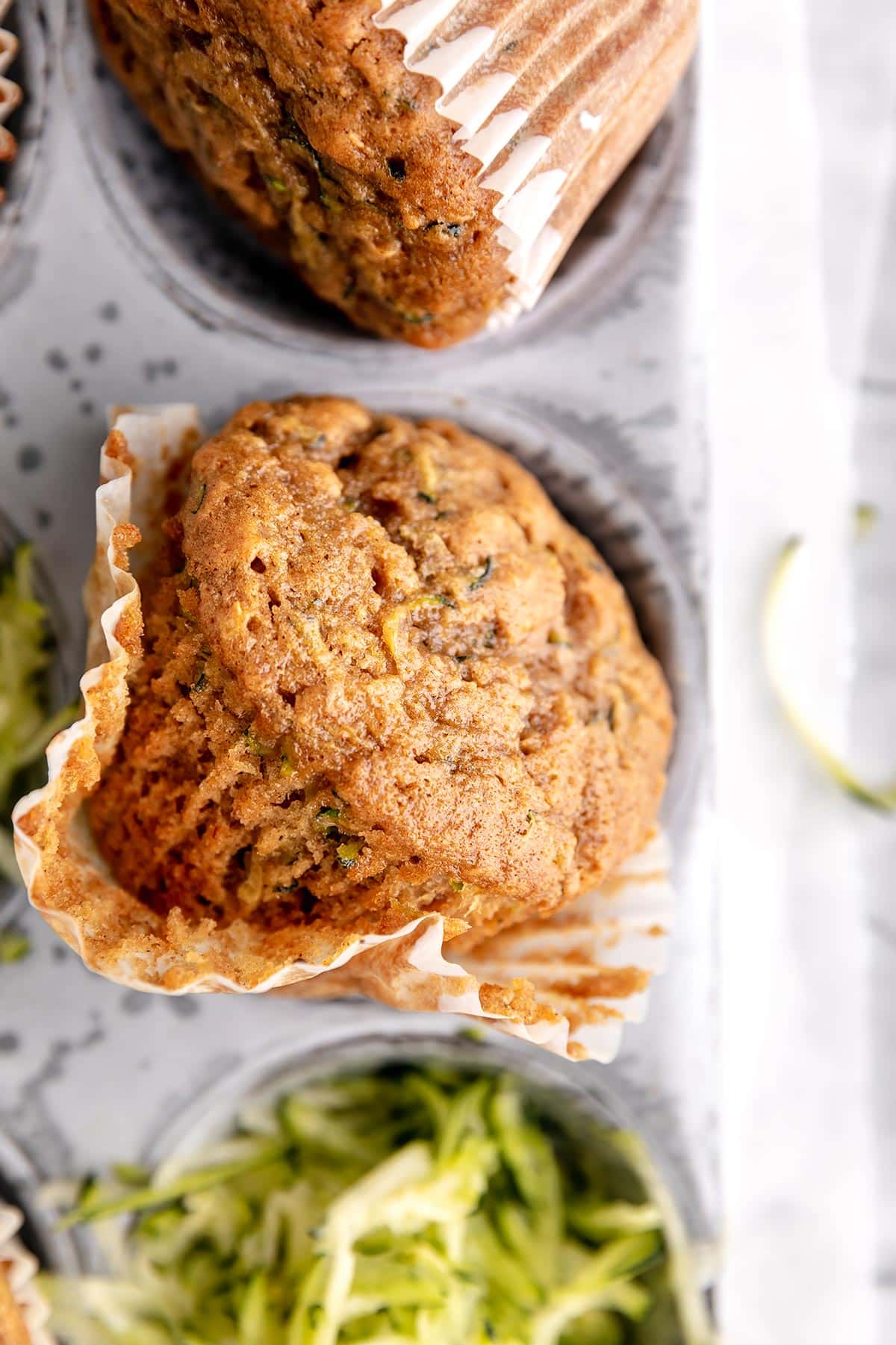 zucchini muffin in a muffin liner.