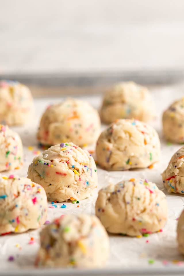 sprinkle cookie dough on a baking sheet pan