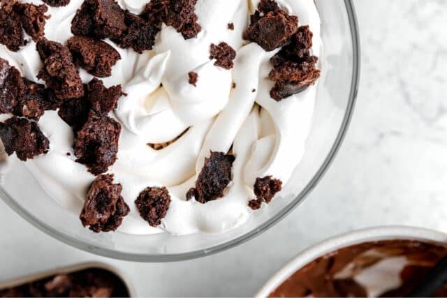 Cool whip covered with brownie crumbles.