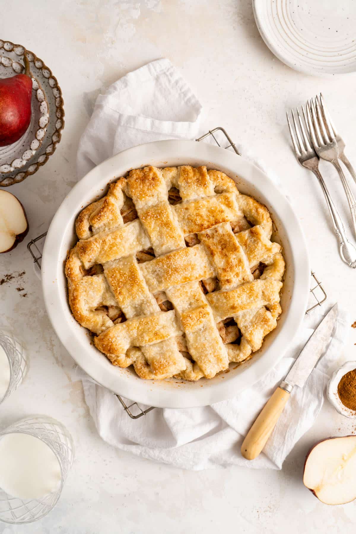 Homemade pie with a lattice crust over pear slices.
