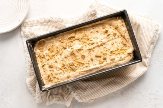 pour ice cream into a loaf pan and top with crushed graham cracker