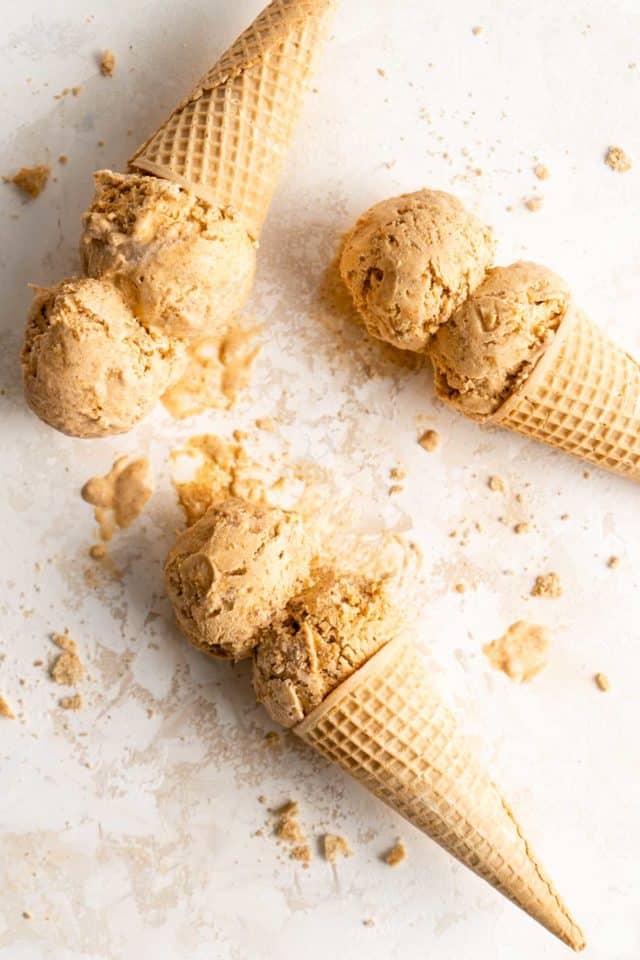 double scoops of pumpkin ice cream in sugar cones