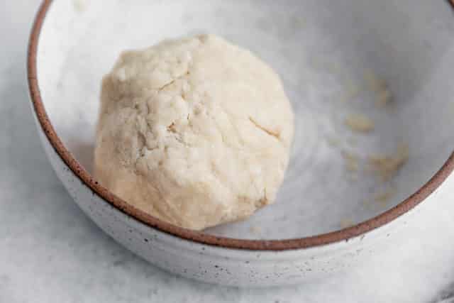 ball of pie crust dough in a bowl