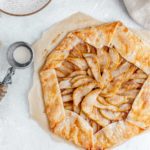 Pear galette on parchment paper.