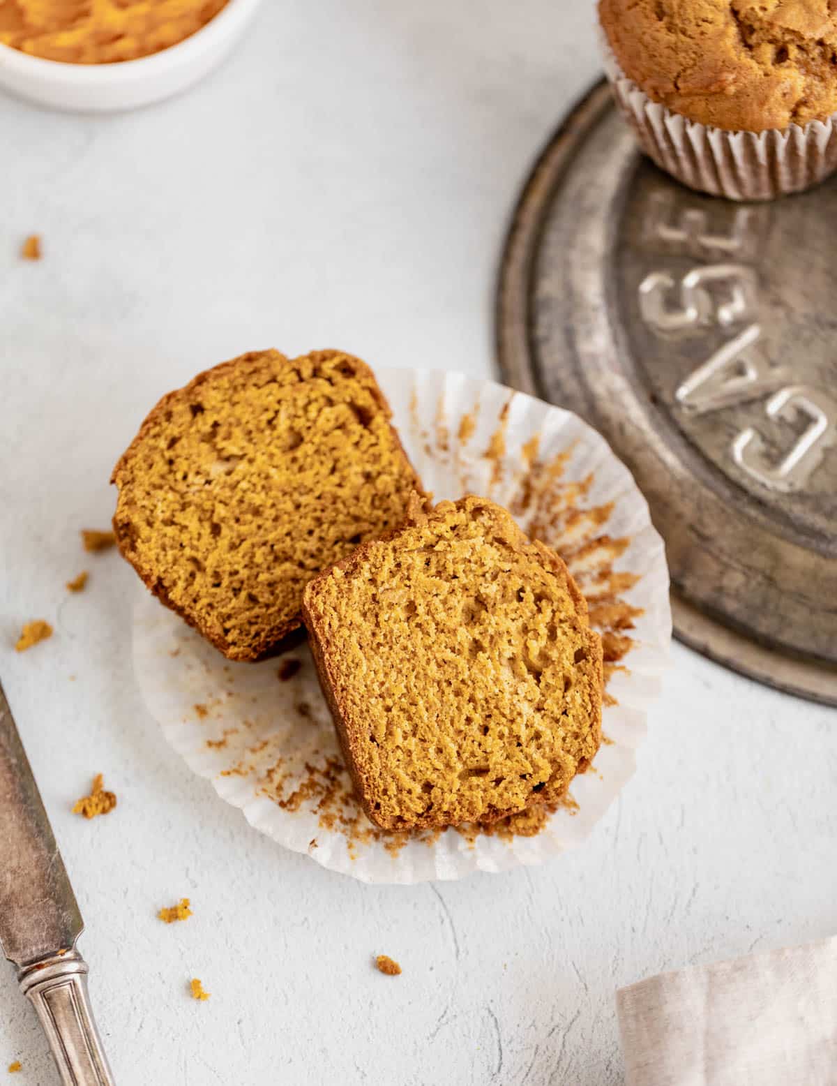 Pumpkin muffin cut in half.