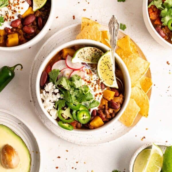 Butternut squash chili topped with sliced jalapeños, radishes and sour cream.