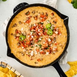 cheese sausage dip cooked in an iron skillet