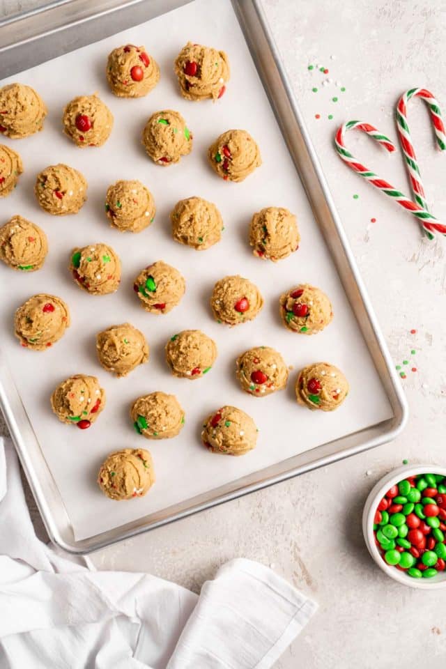 Christmas Cookie dough balls on a baking sheet pan
