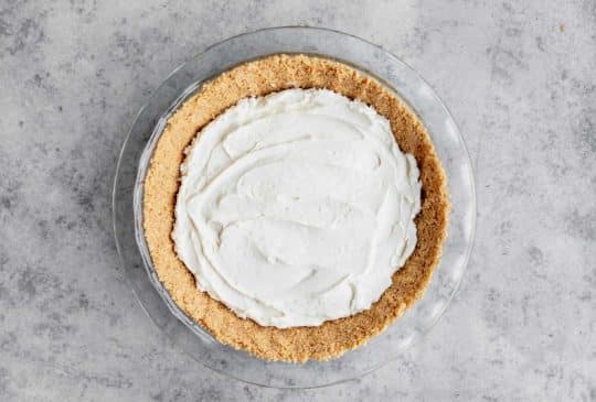 spread cream cheese cool whip mixture into pie crust