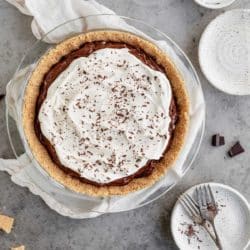 chocolate pudding pie topped with cool whip and chocolate shavings
