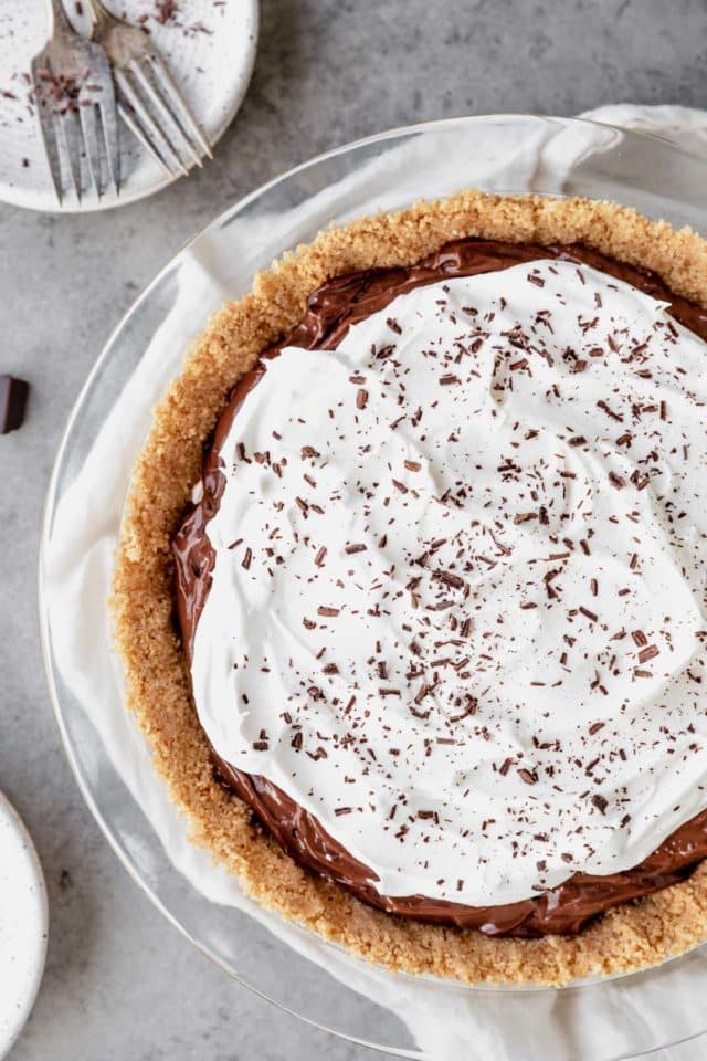 Chocolate pudding pie in graham cracker crust with whipped topping.