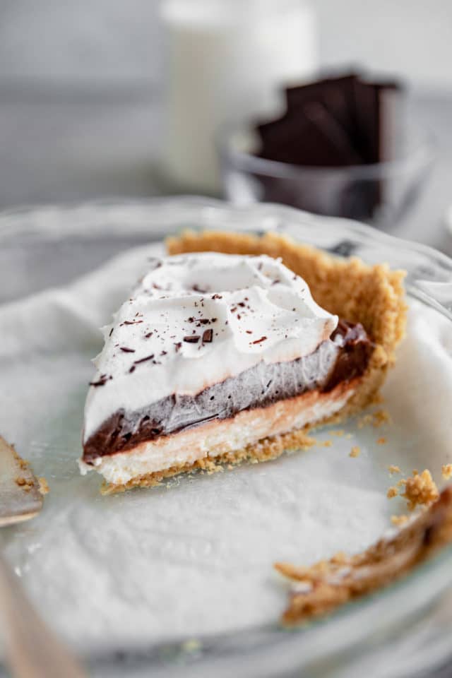 slice of pie with whipped topping in a pie plate