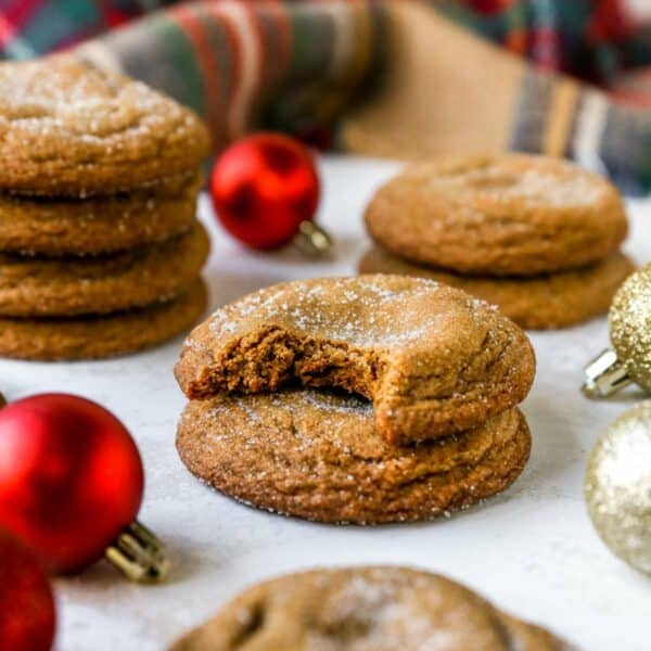 Sugarcoated molasses cookies stacked.