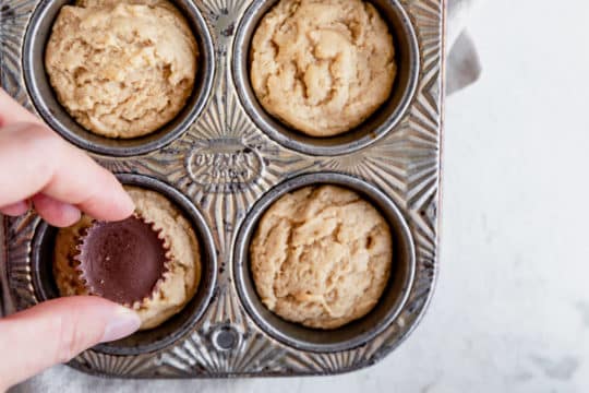 press peanut butter cup into the center of each cookie