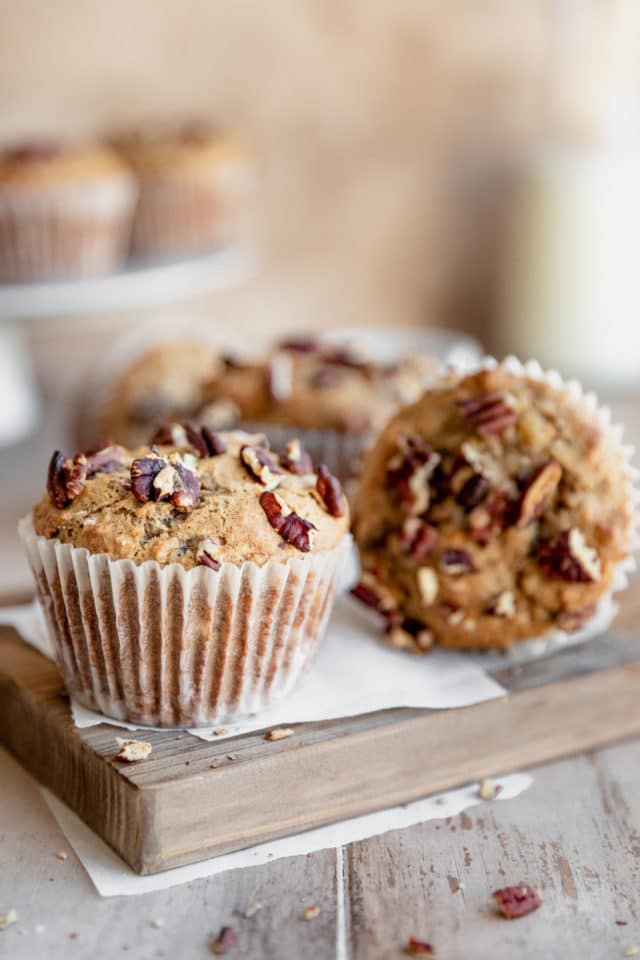 banana muffins topped with chopped pecans