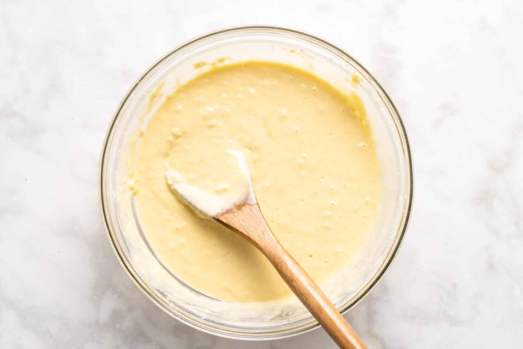 Mixing flour with egg yolks.