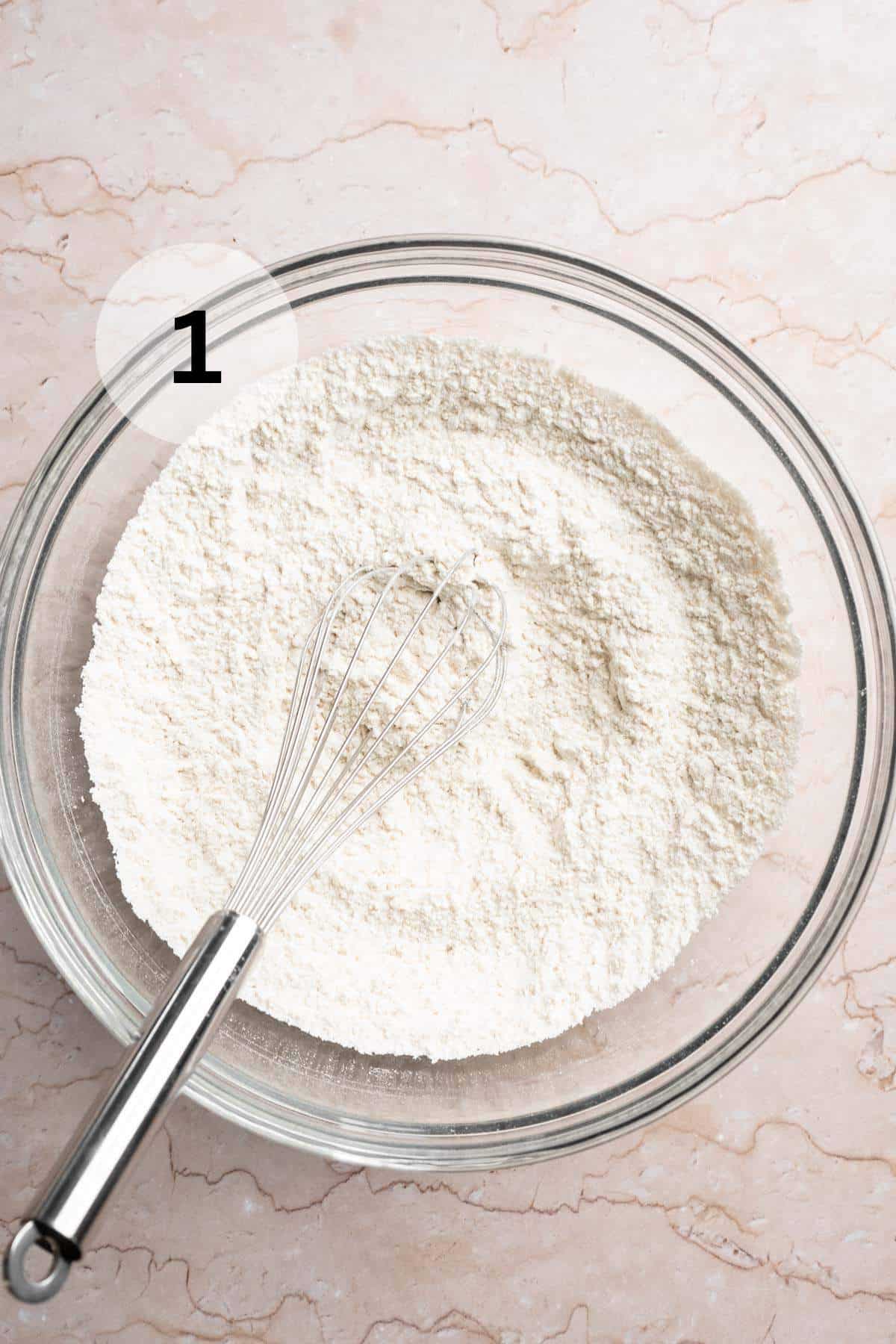 Using a whisk to mix flour, salt and baking powder in a large bowl.
