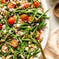 Green bean salad topped with almonds.