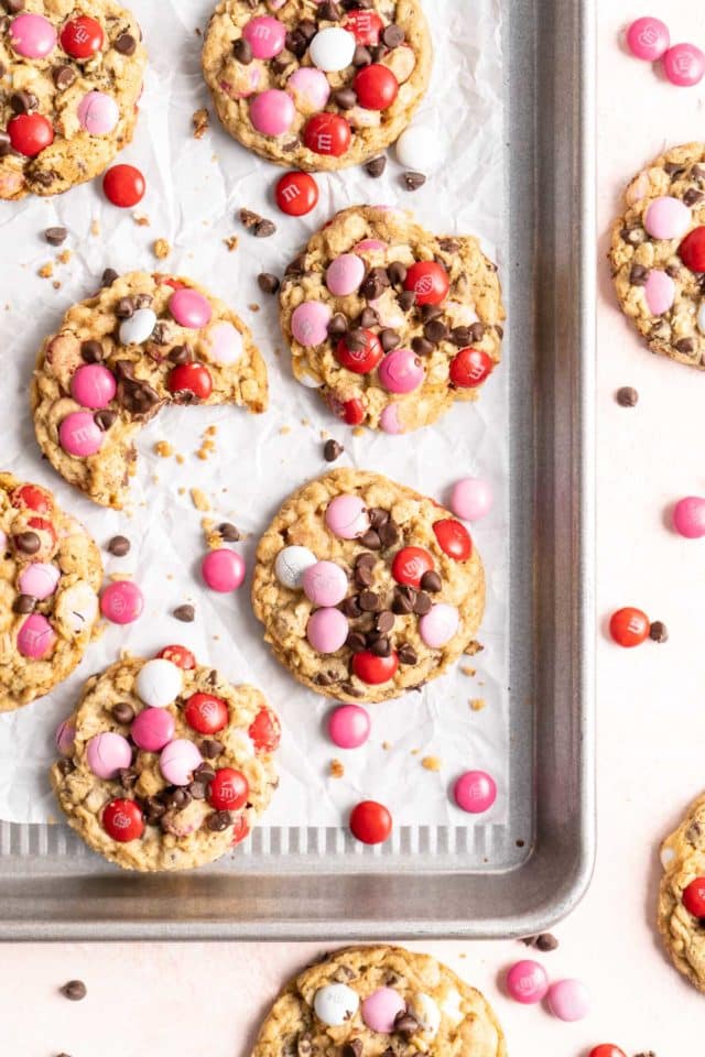 Valentine cookies on a baking sheet with pink, red and white M&M's 