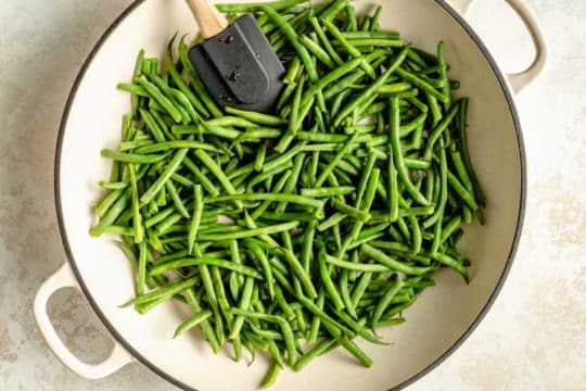cooking fresh green beans in a pot