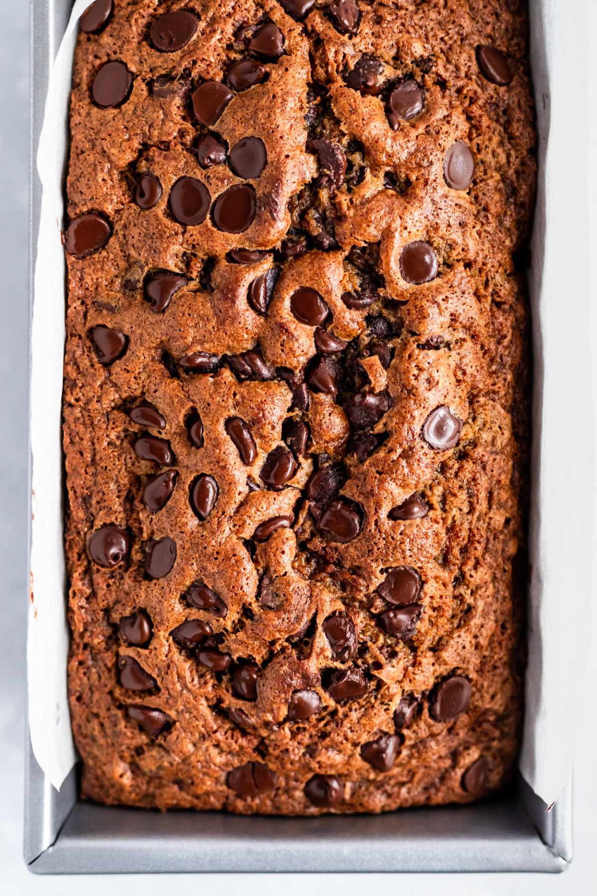 Top of Chocolate Chip Banana Bread in a loaf pan.