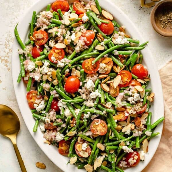 Green beans tossed with tomatoes, almonds and feta cheese.