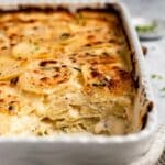 Scalloped potatoes with a serving taken out.