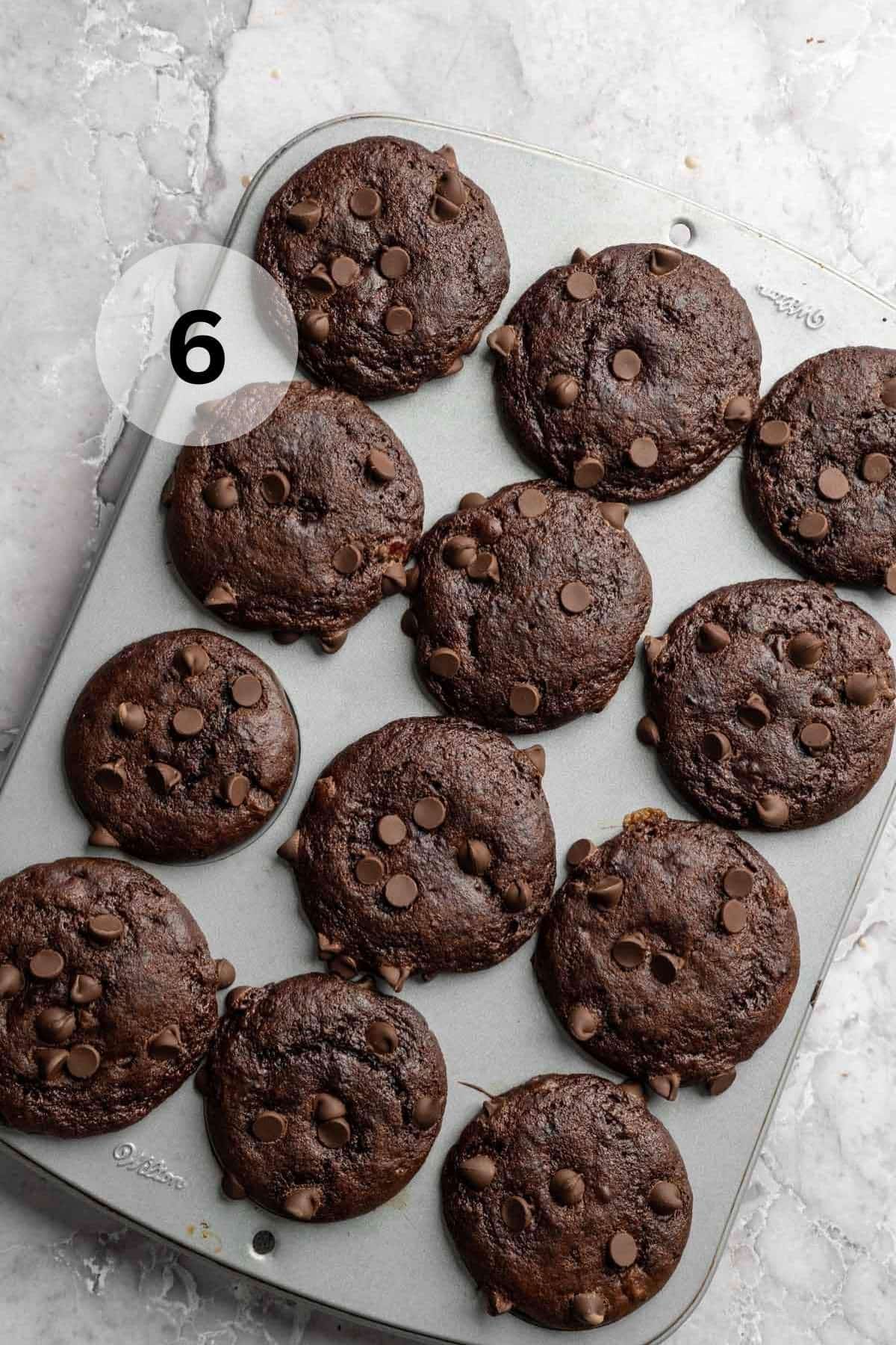 Double chocolate banana muffins in a muffin pan.