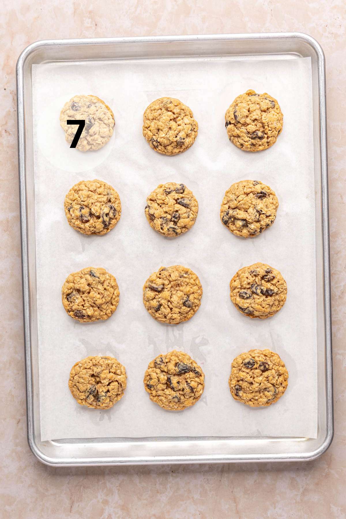 Baked cookies on a parchment-lined pan.